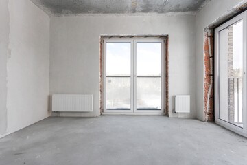 interior of the apartment without decoration in gray colors. rough finish