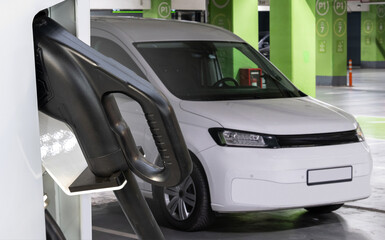 Electric delivery van with electric vehicles charging station on an undeground parking
