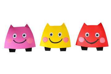 Fototapeta premium Colorful Paper Cat Shapes with Smiling Faces on a Transparent Background for Fun and Playful Artistic Projects