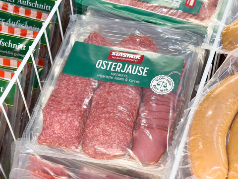 Packaged austrian osterjause salami with green label in supermarket display