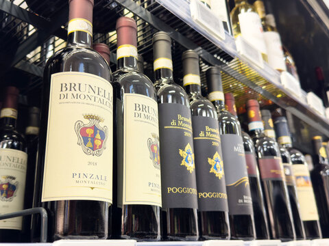 Brunello di montalcino wine bottles on store shelf displaying italian labels