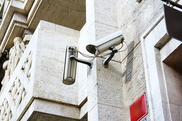 Urban surveillance system featuring cameras and sensors monitoring city streets. Advanced...