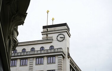 Clock tower. Historic architecture. White building. City landmark.

