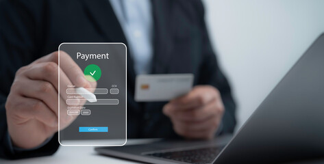 Businessman making an online payment with a credit card on a digital transaction interface symbolizing secure e-commerce and financial security