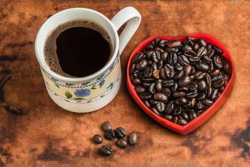 Coffee cup coffee beans on wooden table.
