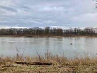 fishermen wading in the river