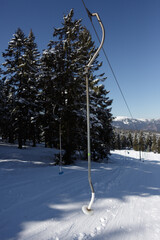 Empty button drag lift on a beginner slope in the mountains