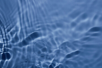 Calm Blue Water Surface with Ripples and Gentle Waves Reflections