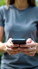 Woman using smartphone outdoors, engaged in communication and technology, enjoying connectivity in nature, modern lifestyle concept