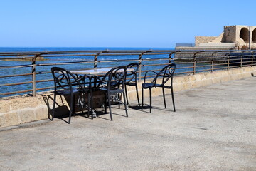Chair and table in a cafe on the seashore