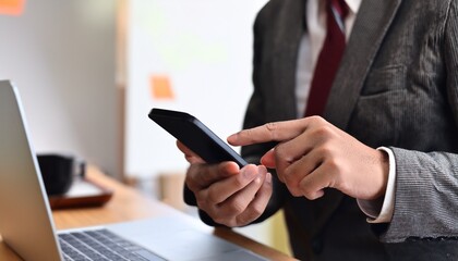 Businessman checking his smartphone