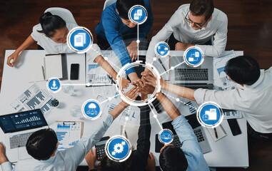 Diverse team engaged in collaborative business management, highlighting technology integration and...