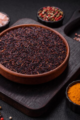 Red or brown raw rice in a ceramic bowl