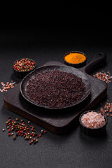 Red or brown raw rice in a ceramic bowl