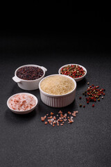 White raw rice in a ceramic bowl. Rice as an ingredient