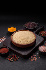 White raw rice in a ceramic bowl. Rice as an ingredient
