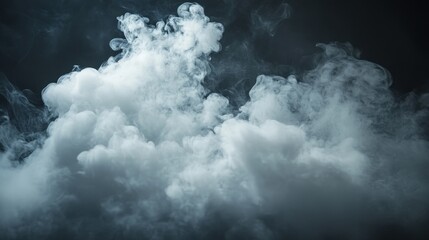 Obraz premium Dramatic white smoke swirls against a stark black backdrop. A captivating study in contrast and form