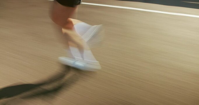 Running, fitness and motion blur of legs of person in city for workout, marathon training and exercise. Sports, fast and athlete on street with speed for challenge, endurance and performance for race