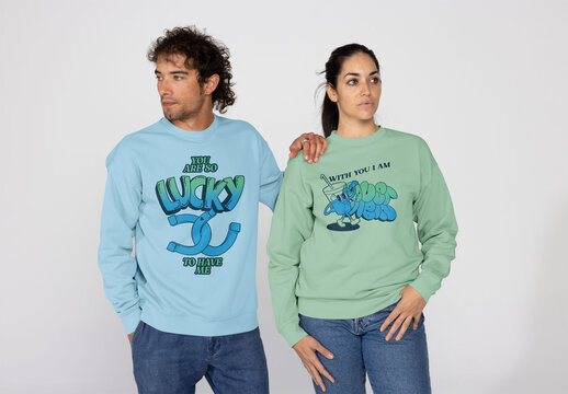 Multiracial Couple Showcasing Stylish Pullovers.PSD mockup