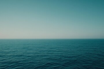 Fototapeta premium The ocean is calm and peaceful, with no signs of life visible. strategy with minimalist waves in light blue and white.