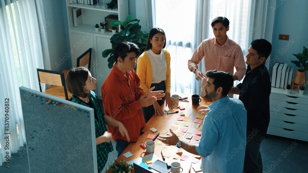 Aufkleber top view of smart business team writing marketing idea on colorful sticky notes while start up team 