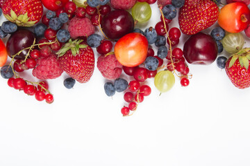 Various summer Fresh berries in a white background.. Antioxidants, detox diet, organic fruits. Top view
