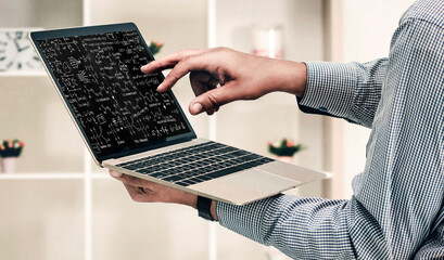 Mathematic equations and modish formula on computer screen showing concept of science and education