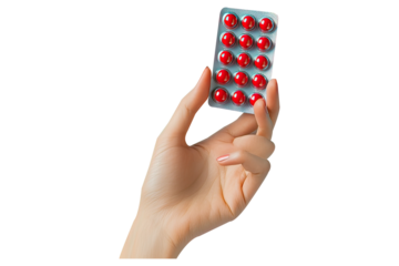 Handing a blister pack of red capsules closeup o