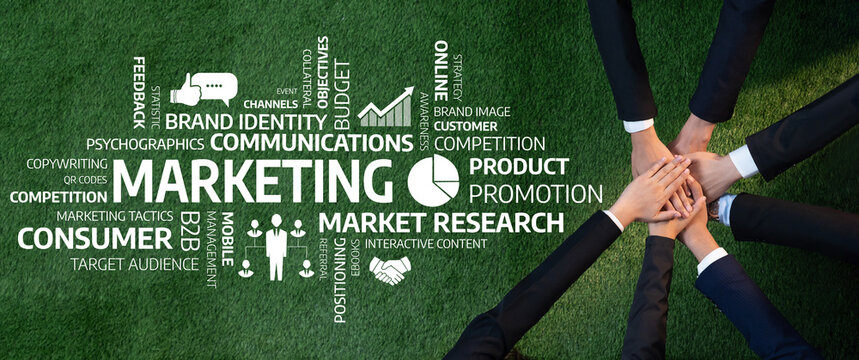 This image showcases a collaborative marketing effort, featuring hands united on green grass, symbolizing teamwork in research, promotion, and communication for success. Amity