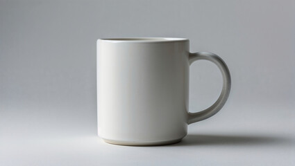 Fototapeta premium A simple, yet elegant white mug, perfect for your favorite beverage, on a neutral background. Its smooth surface catches the light gently.