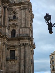 Malaga, Spain - October 09, 2024: Travelling around the small town in Spain in autumn. Beautiful coloured houses and old architecture from south europe.