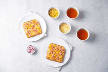 Cheese corn sausages baked sandwich in a plate