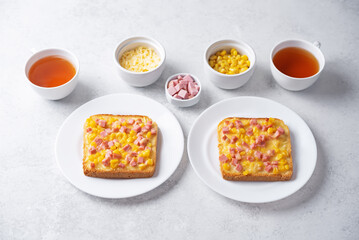 Cheese corn sausages baked sandwich in a plate