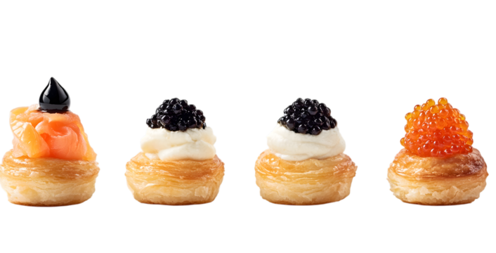 Delicious red caviar canapes on fresh bread served as a tasty snack isolated