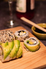 sushi portions on a wooden board and soft lighting