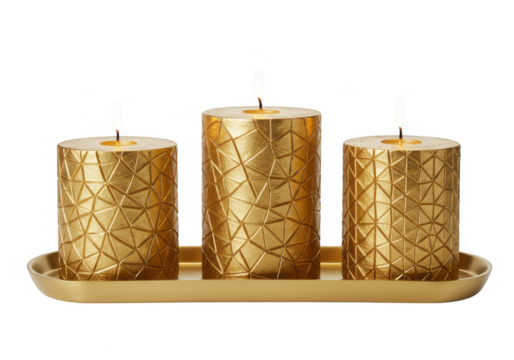 Gold decorative candles with geometric patterns placed in a matching gold tray isolated on transparent background