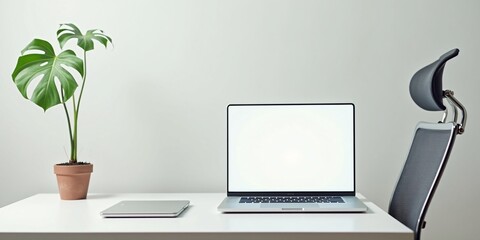 Fototapeta premium Minimalist Scandinavian Workspace – A clean white desk with a laptop 