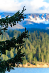 Snow-capped and forested mountains near a mountain lake, Pikes Peak Mountains in Colorado Spring, Colorado