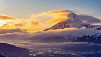 Snowy mountain landscape at sunset with cloudy sky