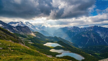 A serene landscape featuring a mountain range and a lake in the foreground, perfect for use as a calming background or scenic reference