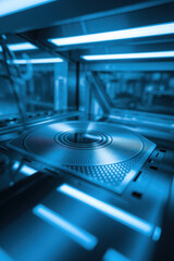 Futuristic High-Tech Laboratory with Blue Lighting Showcasing Precision Equipment and Reflective Surfaces