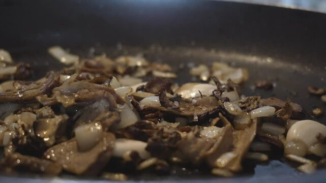 Porcini Soaking Water Poured into Pan &ndash; 4K Slow Motion 120fps
