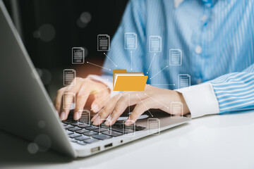 Hands typing on laptop with file organization graphic, Business concept