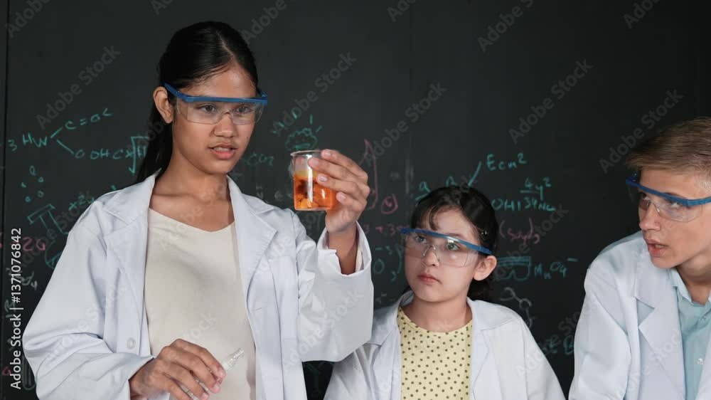 Poster diverse student mixing colored solution while doing experiment at table with microscope or tube with