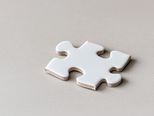 Obraz premium Solving the puzzle a single white jigsaw piece on a neutral background conceptual focus on completion minimalist style