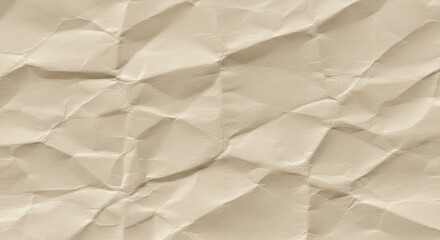 Fototapeta premium A close up of crumpled beige paper showing its texture and shadows in a detailed view for backgrounds