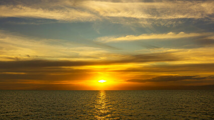 Stunning sunset over calm ocean waters