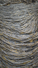 Close-up of solidified pāhoehoe lava with rope-like textures, formed during the Fagradalsfjall volcanic eruption in Iceland.