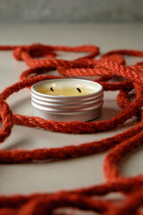Artful arrangement of jute rope and candle creating serene ambiance