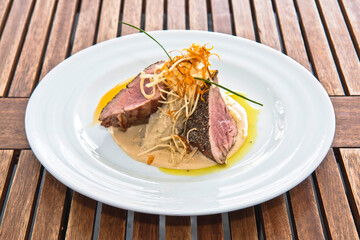 Roast pork, roast pork shoulder with mashed potatoes and carrots, on a wooden table, food